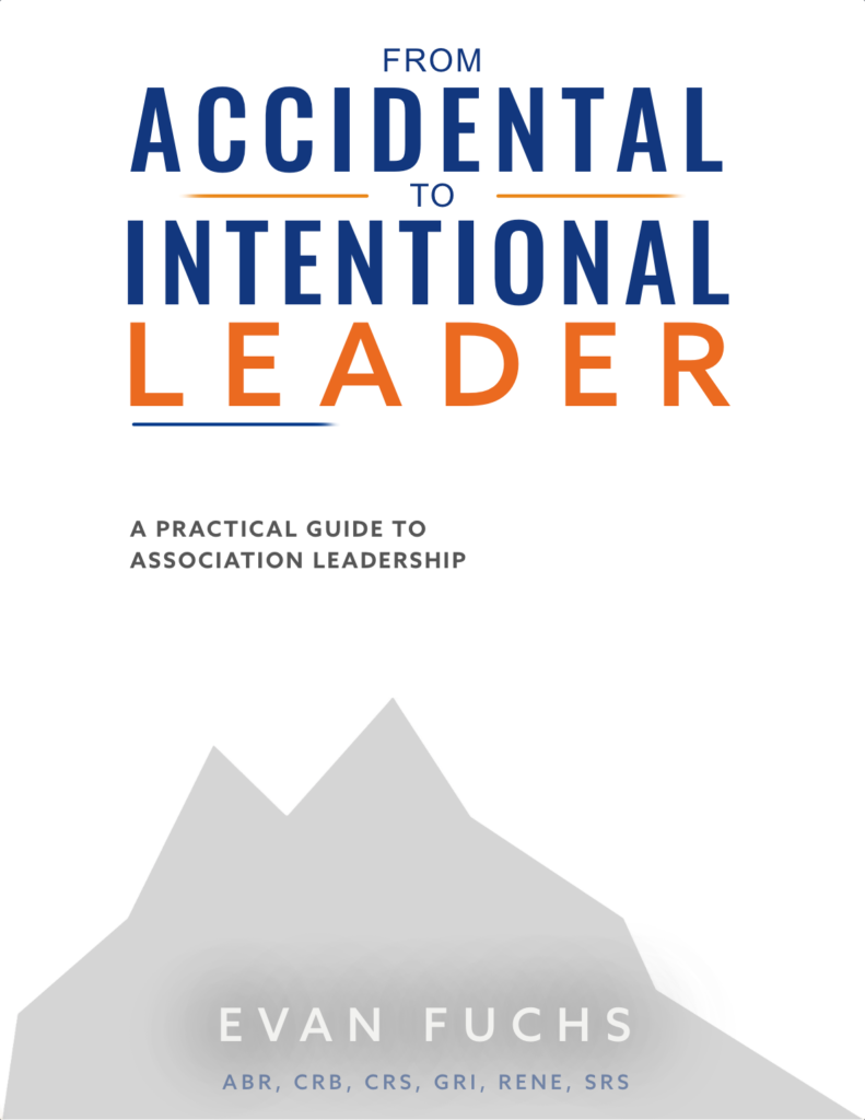Book cover titled From Accidental to Intentional Leader: A Practical Guide to Association Leadership by Evan Fuchs. The cover features bold blue and orange typography on a white background with a minimalist gray mountain graphic.